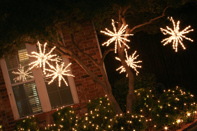 picture of a tree decorated with led light bursts